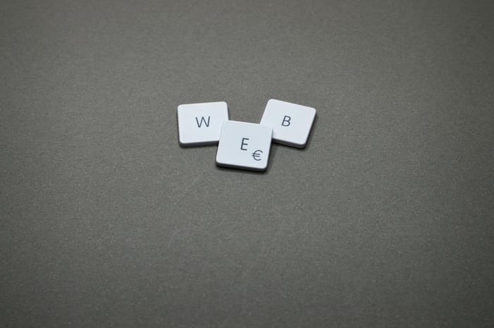 Minimalist image of keyboard keys spelling 'WEB' on a plain background.